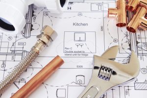 Plumbing Tools Arranged On House Plans